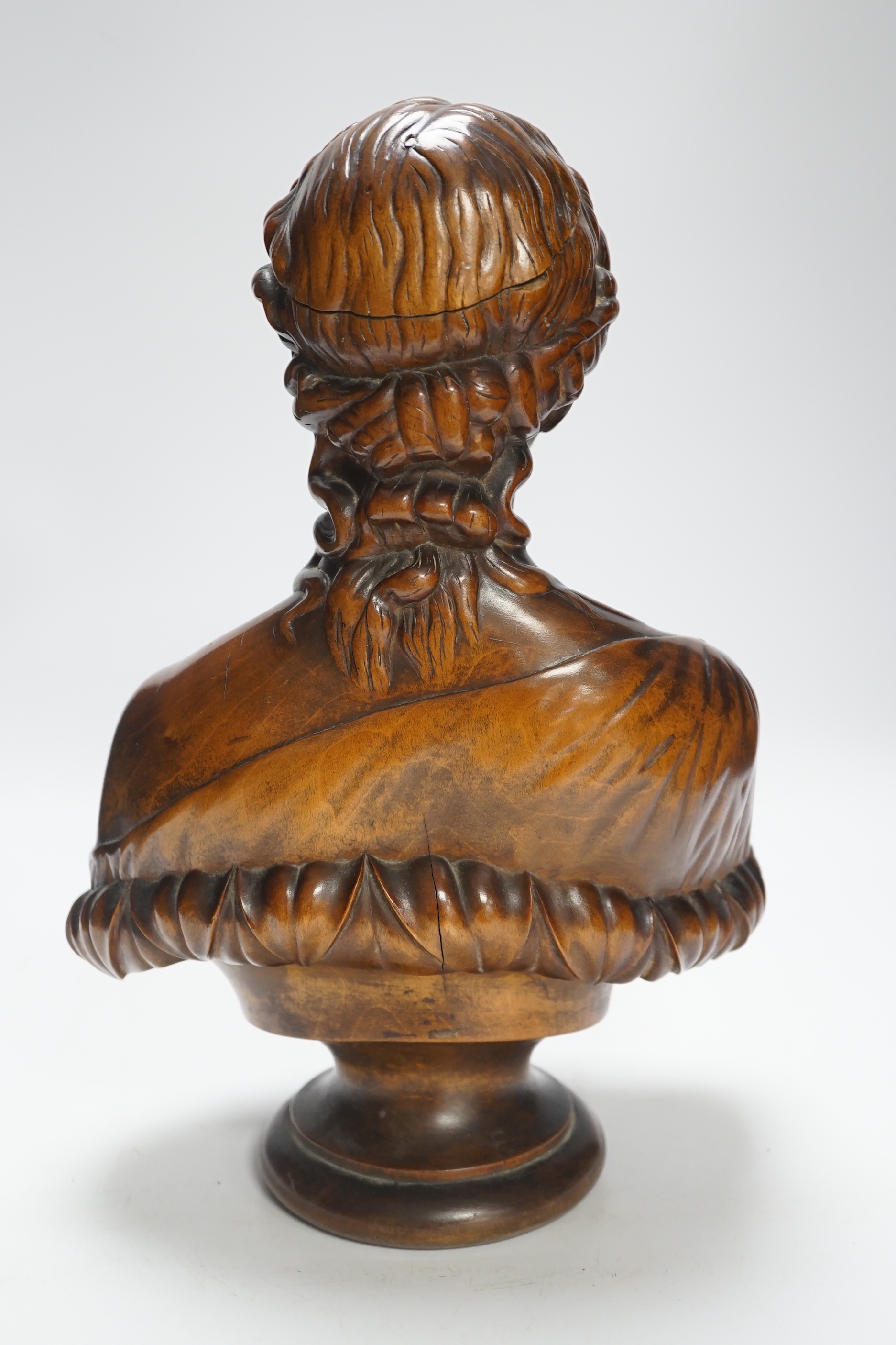 A carved walnut bust of Clytie, possibly Italian, 35cm high